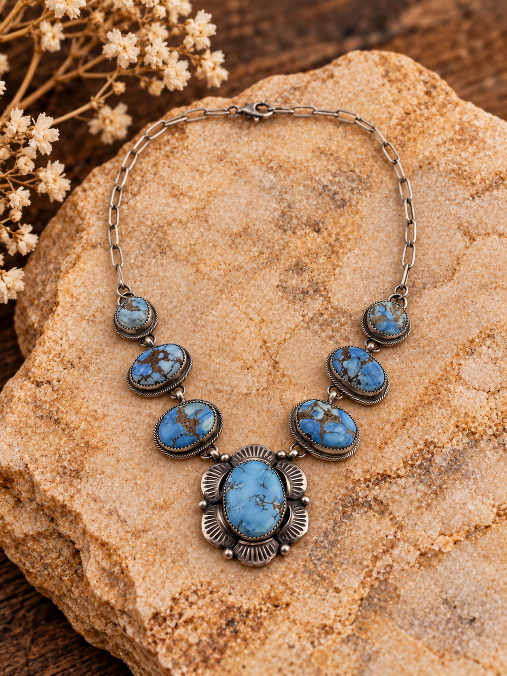 Bob Becenti seven-stone turquoise sterling silver necklace with styled stone background