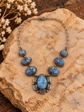 Bob Becenti seven-stone turquoise sterling silver necklace with styled stone background
