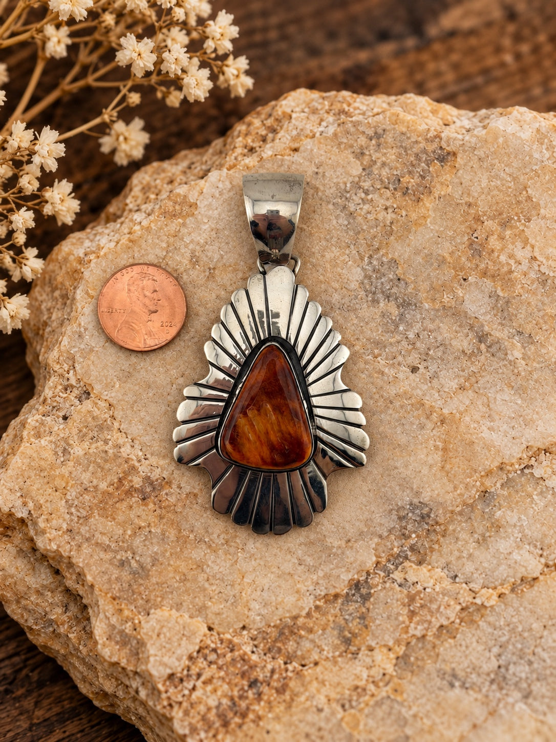 Spiny Oyster Fan Sterling Silver Pendant shown beside a penny for scale